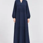 Navy blue closed abaya dress for women with crossover V-neckline, horizontal pintuck detailing and balloon sleeves, front view
